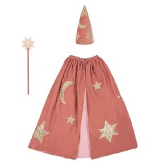 a pink dress with gold stars on it and a star wand in the back ground