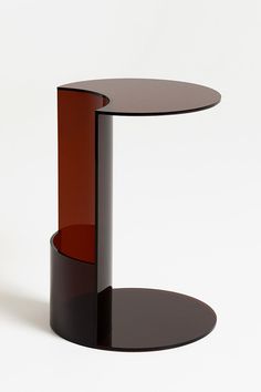 a black and red glass table on a white background with no one around it or someone else