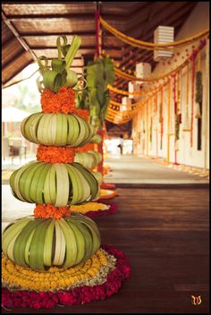 there are many bananas stacked on top of each other in the middle of a walkway