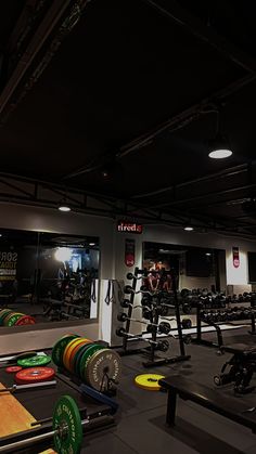 a gym with rows of exercise equipment