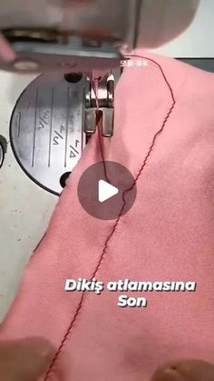 someone is using a sewing machine to sew on pink material with the words diks atmansna son