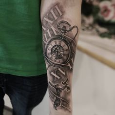 a man with a clock tattoo on his arm