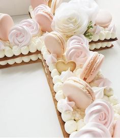 there are two slices of cake decorated with pink and white frosting roses on top