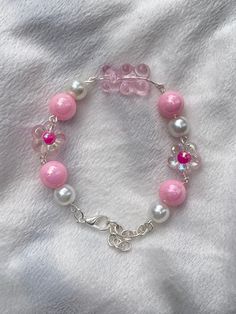 A pink bracelet with a touch of cream. This bracelet makes your feature look lovely. made with quality beads and a strong link bracelet. Gummy Bear Bracelet, Girl Hobbies, Bear Bracelet, Gummy Bear, Themed Jewelry, Pink Bracelet, Gummy Bears, Jewelry Inspo, Chain Link Bracelet