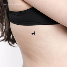 a woman with a small tattoo on her stomach