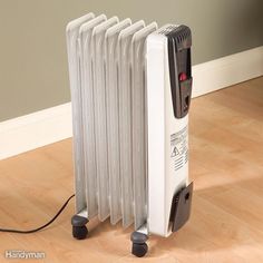 an electric radiator sitting on the floor next to a wall