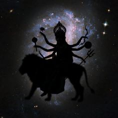 the silhouette of a person riding on top of a cow in front of a star filled sky