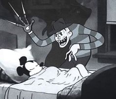 an animated image of mickey mouse in bed with the cat looking at him as he is hooked up