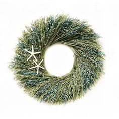 a wreath with two starfishs on it and some green grass around the edges