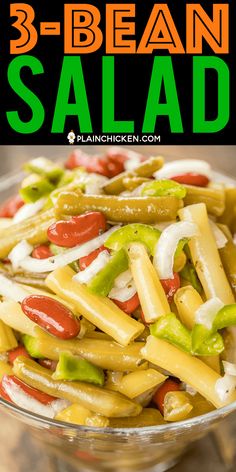 a salad with peppers and onions in a glass bowl