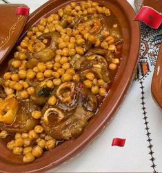 there is a large bowl filled with food on the table