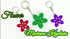 three different colored keychains with the words flower on them in black, white, and green