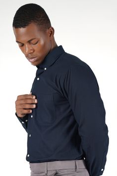 Elevate your wardrobe with our Ebony Navy Clay Blue Royal Oxford Shirt, featuring a classic button-down collar. This shirt combines timeless elegance with modern sophistication. The deep ebony clay blue shade adds depth and versatility to any ensemble. Made from premium fabric, it ensures comfort and durability. Perfect for both formal and casual occasions, this shirt is a must-have for the style-conscious individual. Fused collar and cuffs, collar stand and flat felled side seams provide struct Formal Casual, Shoulder Shirts, Oxford Shirt, Button Down Collar, Collar And Cuff, Full Sleeve, Body Measurements, First World, The Deep