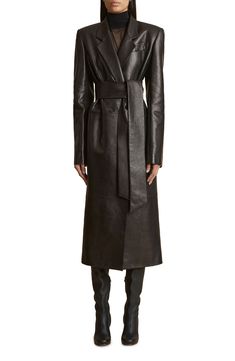 A strong silhouette cinched by a waist-width tie belt brings a sharp-looking, no-nonsense aesthetic to this longline coat tailored from supple lambskin leather. 48" length (size 6) Double-breasted button closure Notched lapels Four-button cuffs Chest welt pocket; on-seam welt pockets Removable tie belt Back vent Lined Leather Professional leather clean Made in the USA Designer Clothing Nonsense Aesthetic, Long Leather Coat, Longline Coat, Leather Cleaning, Nordstrom Store, Black Fits, Tie Belt, Lambskin Leather, Leather Coat