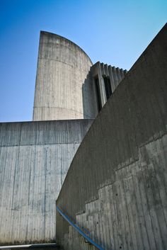 a man riding a skateboard down the side of a cement wall