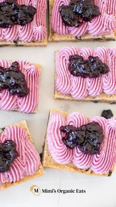 four pieces of toast with pink and purple frosting