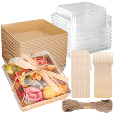 there are many items in the box and tied with twine, including donuts