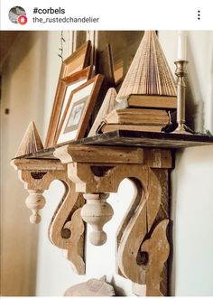 an old wooden shelf with books and pictures on it