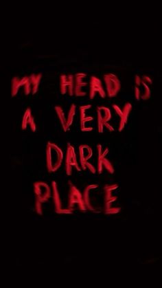 a sign that says, my head is a very dark place with red writing on it