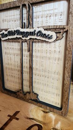 an old sheet music frame with the words, the all - fingered cross on it