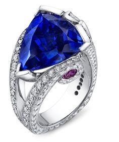 Engraved platinum ring featuring a 11.87ct tanzanite accented with 2.77ctw of white diamonds, and pink sapphires. Bling Rings, Blue Jewelry, Buying Guide, Unique Rings, Luxury Jewelry