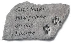 a rock with a paw print on it that says cats leave paw prints on our hearts