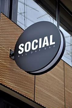 a black and white sign that says social all day hair on the side of a building