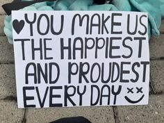 a sign that says you make us the happiest and proudest every day