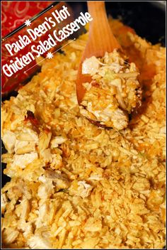 a wooden spoon scooping some food out of the crock pot with chicken and seaweed casserole