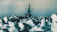 an old black and white photo with a boat in the background