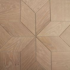 a close up view of a wood floor with different patterns on the side and sides