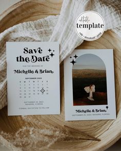 two save the date cards sitting on top of a wooden bowl