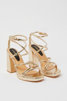 Introducing the Teddy Strappy Platform High Block Heeled Sandals! These stunning gold sandals are the perfect addition to any outfit. Designed for both style and comfort, these sandals feature a strappy design that adds a touch of elegance to your look. The high block heel provides a boost of height while ensuring stability and support. Whether you're heading to a special occasion or simply want to elevate your everyday style, these sandals are a must-have. Pair them with a skirt for a chic and feminine ensemble that will turn heads wherever you go. Step out in confidence and style with the Teddy Strappy Platform High Block Heeled Sandals. Grad Heels, Hoco Heels, High Heels Prom, Hoco Shoes, Homecoming Heels, Graduation Heels, Graduation Shoes, Hoco Inspo, Homecoming Shoes