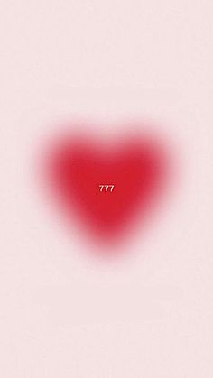 a red heart shaped object with the word 777 written in white on it's side