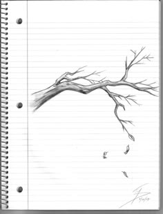 a drawing of a tree branch on top of a notebook with writing paper underneath it