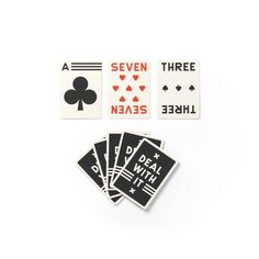 four different playing cards on top of each other