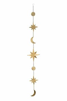 a wind chime with five stars hanging from it's sides and the moon in the middle