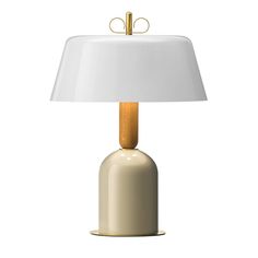 a table lamp with a white shade on the base and a gold metal rod at the top