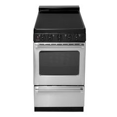 a silver stove top oven sitting next to a white wall