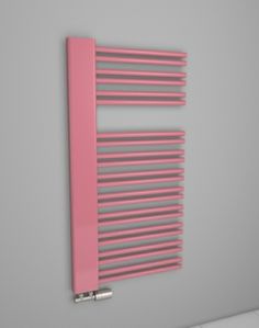 a pink radiator mounted to the side of a wall