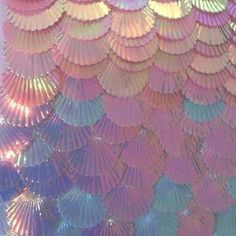 an array of colorful umbrellas hanging from the ceiling