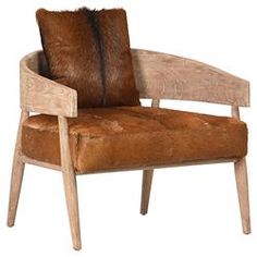 a wooden chair with a fur cushion on it