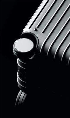 a black and white photo of an electric heater on a dark background with the words, what is it?