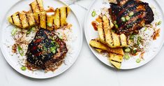 two white plates topped with food next to each other