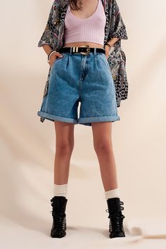 100% Cotton high-waisted shorts in a soft denim fabric. You can roll up the legs to create cuffs, if you choose. The shorts boast of functional pockets on the sides and back as well as functional belt loops. The high waist makes them perfect for pairing with a crop top, such as our Knitted Crop Top Co Ord in Pink, which you see in the photos. The model is 5’11” with measurements of 33-23-35 and is wearing a size small. The fit runs true to size. Pleated Denim, Types Of Jeans, Stretch Denim Fabric, 90s Denim, How To Hem Pants, High Rise Mom Jeans, Shorts Jeans, Short En Jean, Small Light