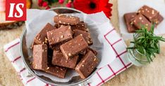 a bowl filled with chocolate on top of a red and white checkered table cloth