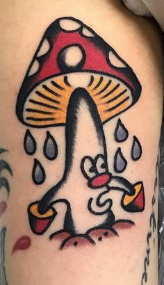 a tattoo with a mushroom and raindrops on it