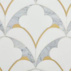 a marble tile with gold and white designs on it