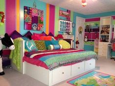 a bedroom decorated in bright colors with zebra rugs on the floor and colorful walls