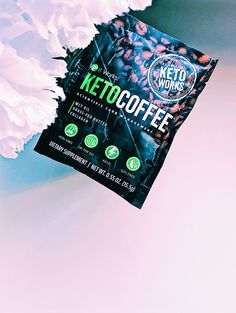 a packet of keto coffee sitting on top of a white carcass flower